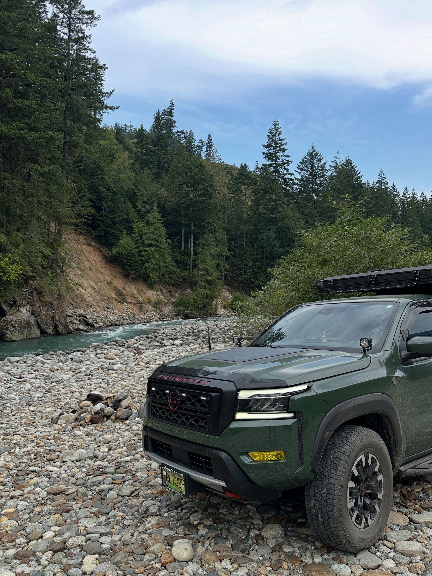 Frontier parked on a riverbed trail