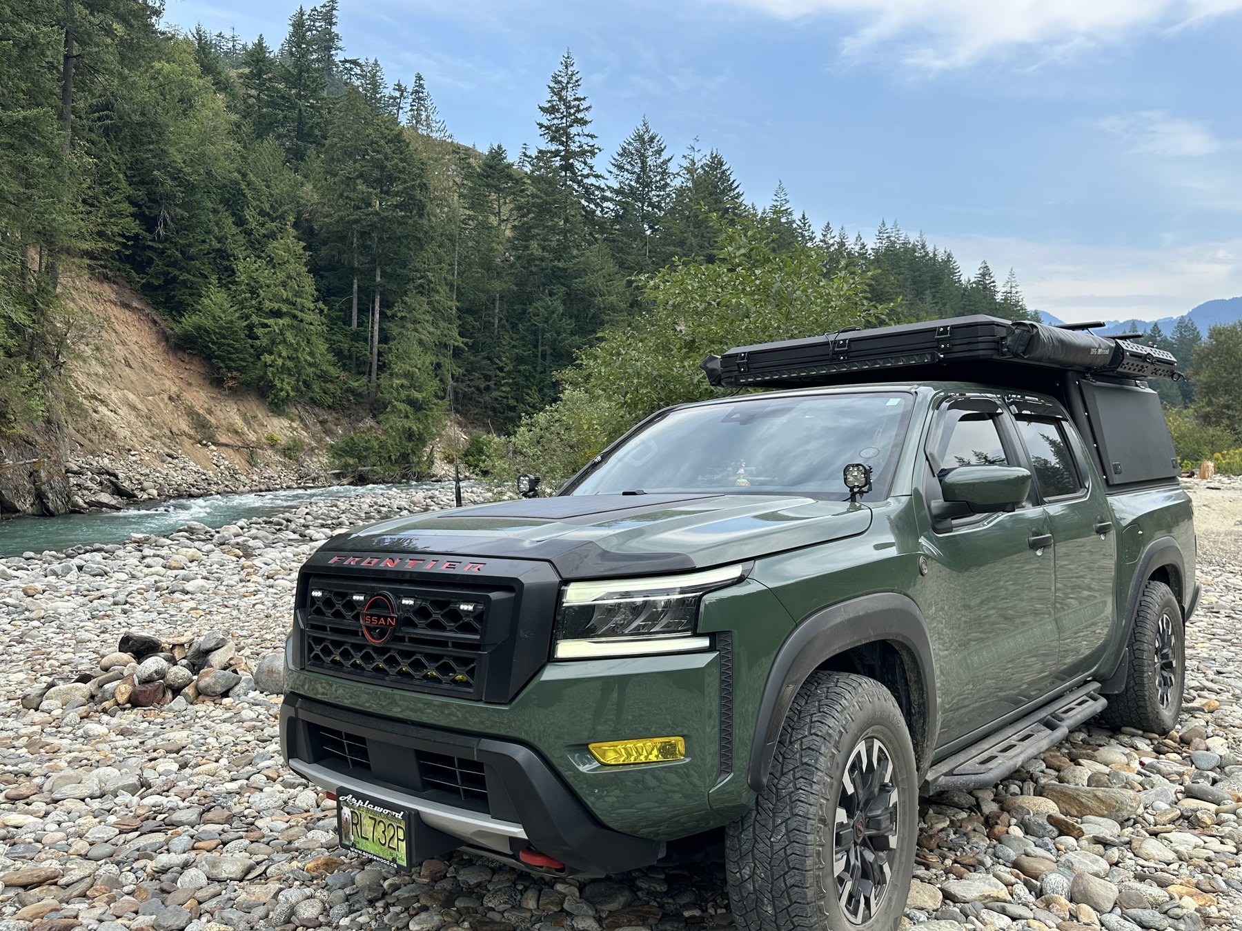 Truck parked on a rocky riverbed in British Columbia